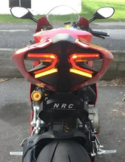 LED tail light on Ducati motorcycle with fender eliminator, showcasing bright turn signals and license plate bracket for superior visibility, ideal for RV, automotive, Powersports, off-road, marine, exterior, truck accessories, interior, truck bed, RV parts, Powersports, AVADA - Best Sellers