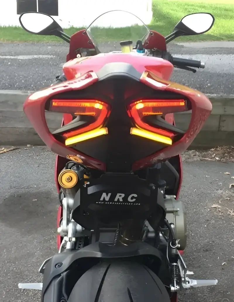 LED tail light on Ducati motorcycle with fender eliminator, showcasing bright turn signals and license plate bracket for superior visibility, ideal for RV, automotive, Powersports, off-road, marine, exterior, truck accessories, interior, truck bed, RV parts, Powersports, AVADA - Best Sellers