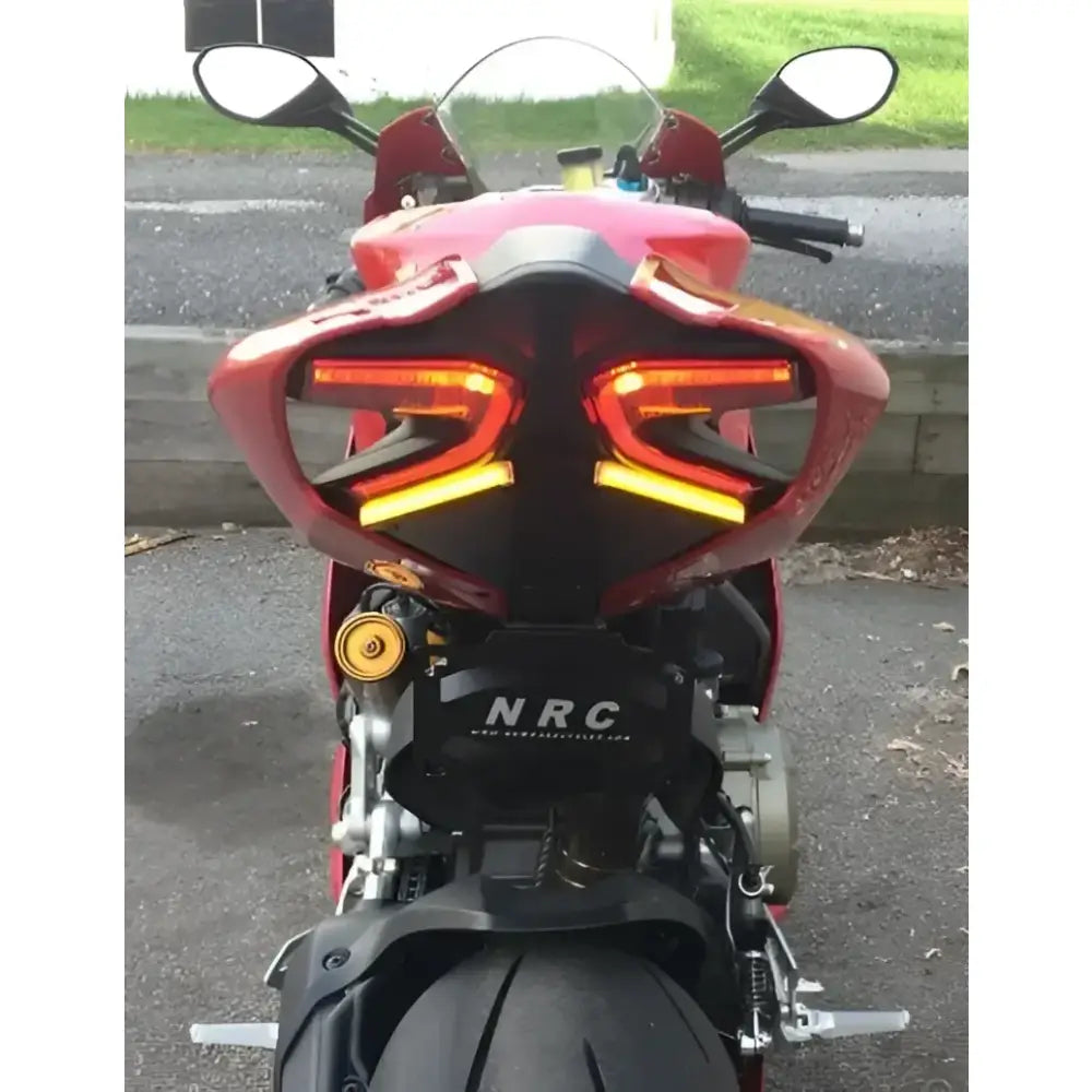 LED tail light on Ducati motorcycle with fender eliminator, showcasing bright turn signals and license plate bracket for superior visibility, ideal for RV, automotive, Powersports, off-road, marine, exterior, truck accessories, interior, truck bed, RV parts, Powersports, AVADA - Best Sellers
