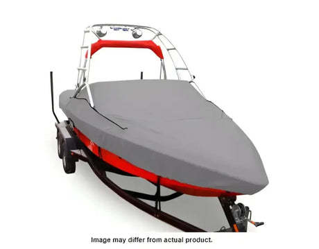 Covered boat on trailer with Carver Boat Cover Vst-19 I/O Twr for protection
