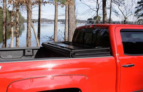 Lund 04-08 Ford F-150 Styleside (5.5ft. Bed) Hard Fold Tonneau Cover - Black 