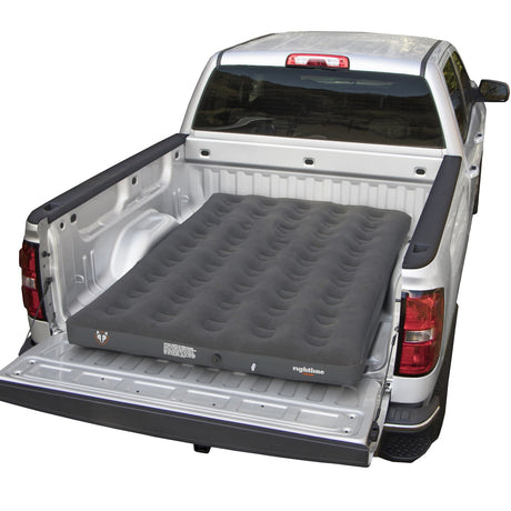 Rightline mid-size air mattress set up in the bed of a white pickup truck, showing its compact and durable design for versatile use.