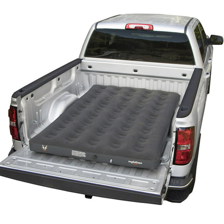 110M60 Rightline Mid Size Air Mattress in the back of a white truck, showcasing its durability and portability for camping and guest use.