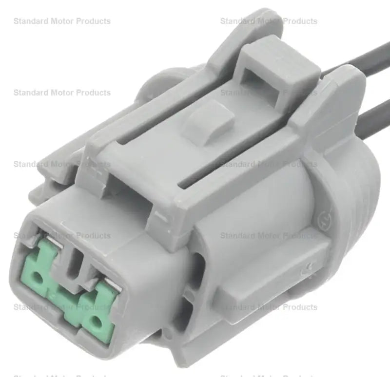 Gray abs wheel speed sensor connector with green inserts for wheel speed sensor repair