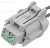 Gray abs wheel speed sensor connector with green inserts for wheel speed sensor repair