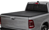 Silver pickup truck with black Lomax trifold bed cover for Ram Classic 5ft 7in