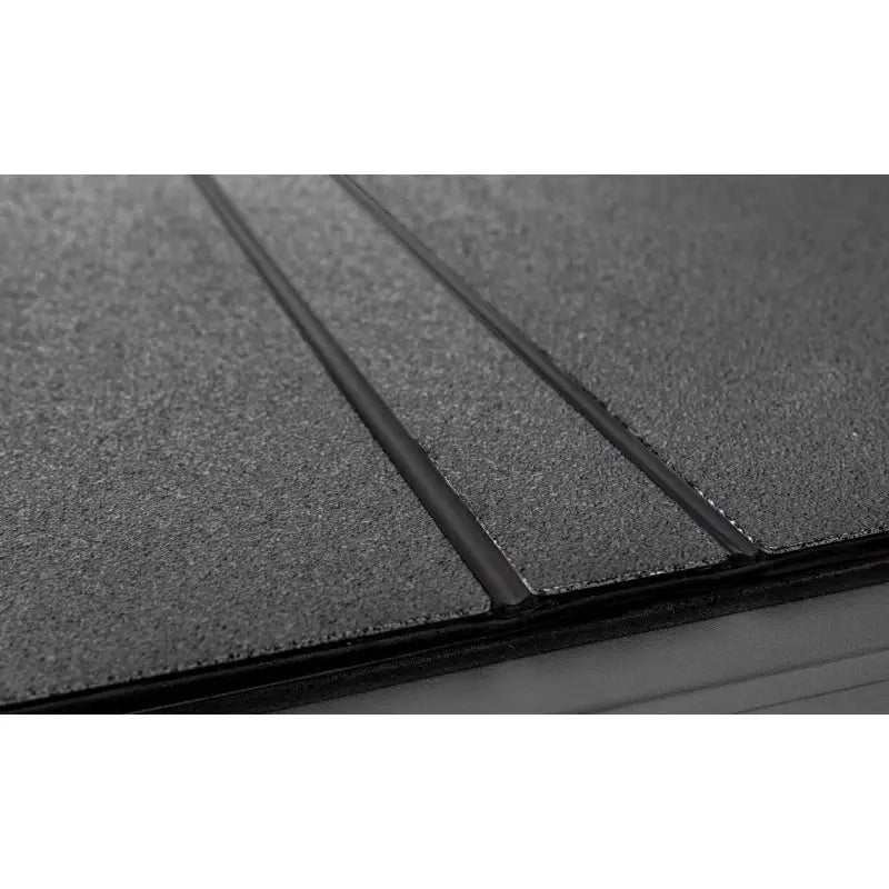 Access B3080019 Access 2022+ Rivian R1T 4ft 6in Bed (w/ OEM Tonneau Track) LOMAX Folding Hard Cover - Black Urethane - B3080019