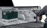 Green and white cooler in truck bed with Access Accessories EZ-Retriever II cargo reaching tool