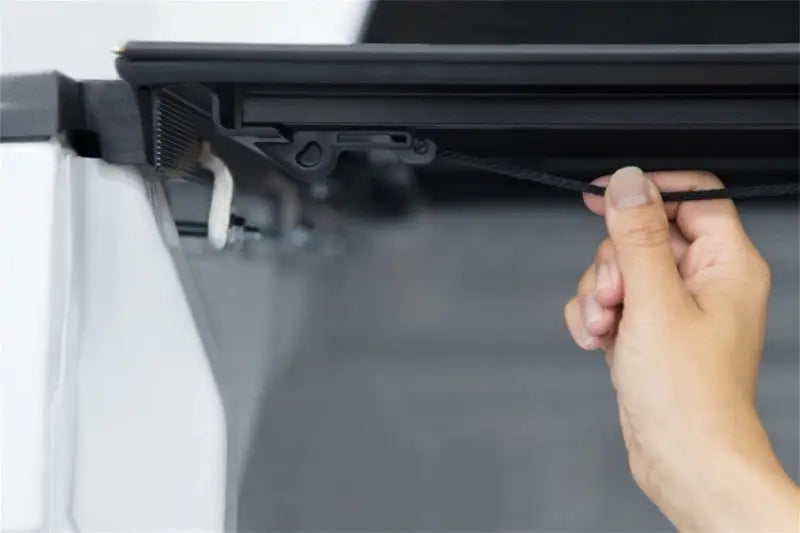 Black laptop showing hinge detail for Lomax tri-fold cover