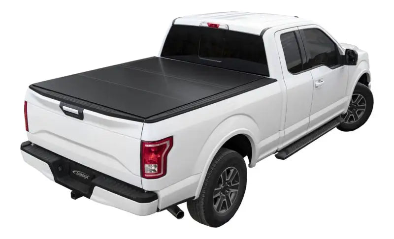 White Ford F-150 with LOMAX tri-fold cover and chrome accents