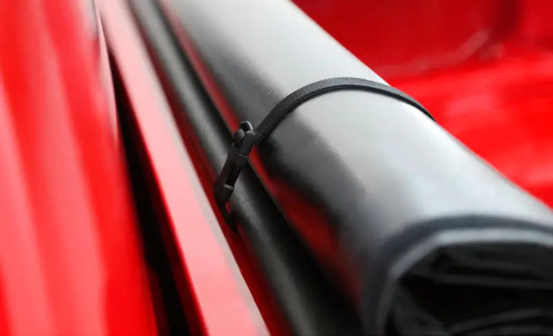 Black zip tie on Ford Ranger window frame for Access Tonnosport roll-up cover