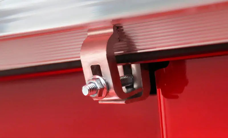 Close-up view of the Access Tonnosport roll-up cover clamp installed on a 2022 Hyundai Santa Cruz 4ft bed.