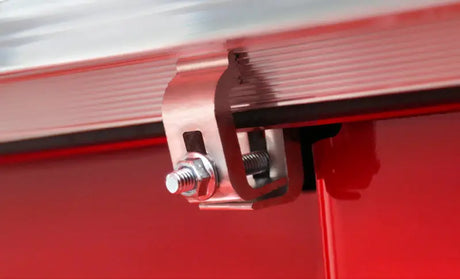 Close-up view of the Access Tonnosport roll-up cover clamp installed on a 2022 Hyundai Santa Cruz 4ft bed.