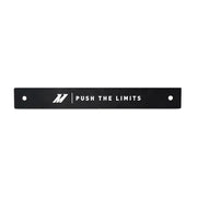 Black metal bar with PUSH THE LIMITS text, perfect for license plate delete accessories