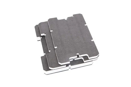 Stack of gray interlocking foam tiles from AD34 Decked customizable foam inserts