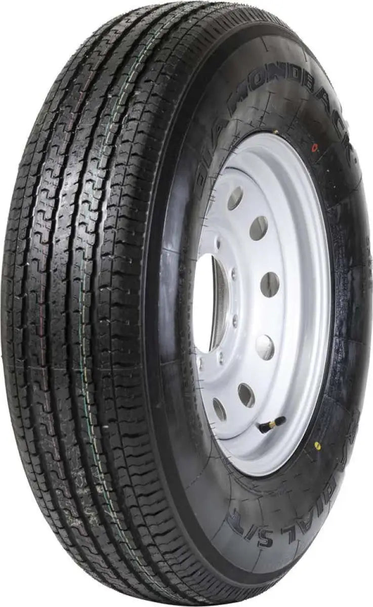 Taskmaster St235/80R16 10 Ply Diamondback trailer tire with white wheel, high-strength construction for heavy-duty use, featuring Diamondback tread for enhanced traction and durability.