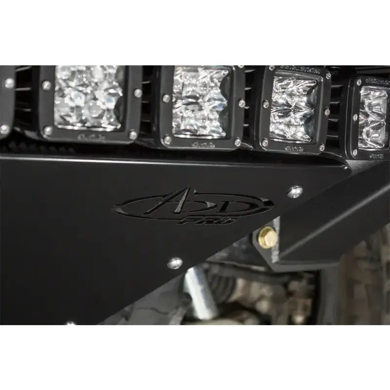 Black metal Addictive Desert Designs ADD PRO Front Bumper with lights for Ford F-150 Raptor