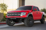 Red Ford Raptor pickup with Addictive Desert Designs ADD PRO Front Bumper