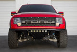 Red Ford Raptor pickup with Addictive Desert Designs ADD PRO front bumper