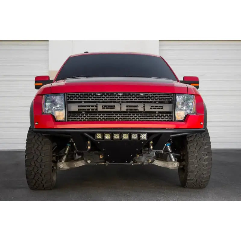 Red Ford Raptor front view with Addictive Desert Designs ADD PRO Front Bumper