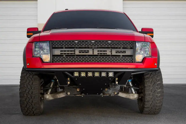 Red Ford Raptor front view with Addictive Desert Designs ADD PRO Front Bumper