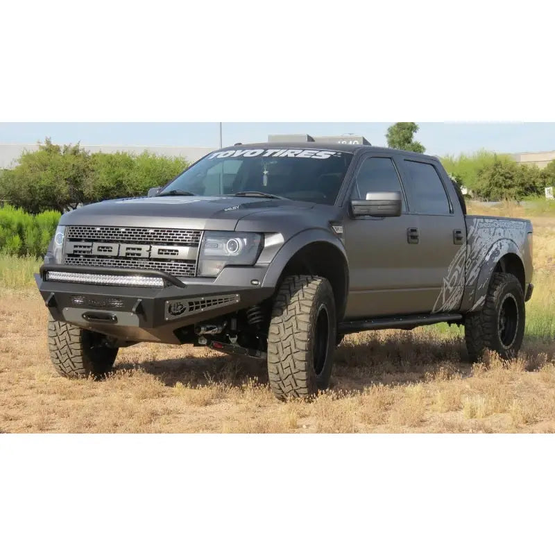 Addictive Desert Designs 10-14 Ford F-150 Raptor HoneyBadger Front Bumper w/ Winch Mount - F017275050103