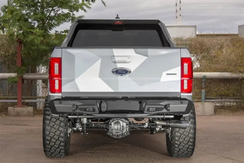 Camouflaged Ford Ranger with Addictive Desert Designs stealth fighter rear bumper
