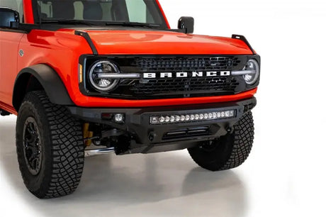 Addictive Desert Designs 2021+ Ford Bronco Stealth Fighter Front Bumper with Winch Mount featuring a 30-inch LED light bar in Hammer Black with Satin Black panels
