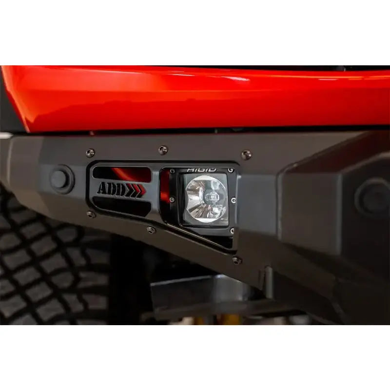 Addictive Desert Designs 2021+ Ford Bronco Stealth Fighter Front Bumper with Winch Mount - Hammer Black Finish, Integrated LED Cube Light, and ADD Logo.