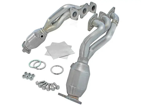 Automotive exhaust headers with catalytic converters and mounting hardware in twisted steel stainless steel long tube style