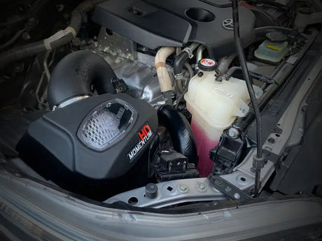 Car engine compartment with aFe 15-20 Toyota Hilux Momentum HD Cold Air Intake System