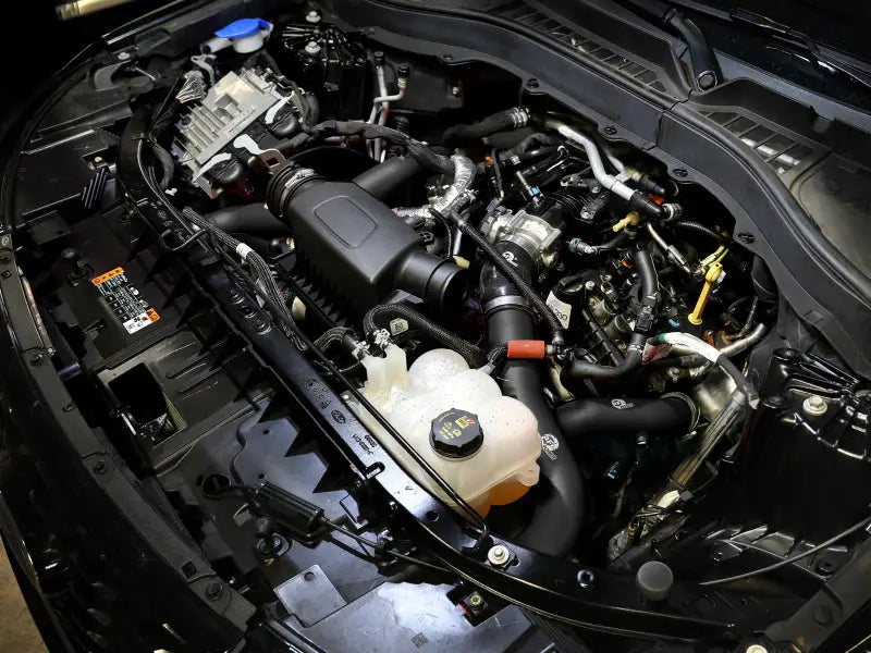 Image of Ford Explorer ST engine with aFe aluminum cold charge pipe in black