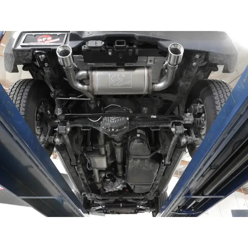 Underside of Ford Bronco with aFe Vulcan Cat-Back exhaust system showing dual pipes