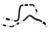 Black rubber automotive hoses with metal clamps on a hot charge pipe for Ford F-150 Raptor