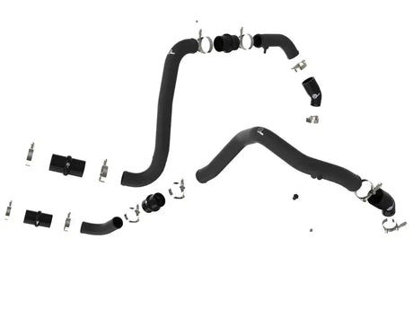 Black rubber automotive hoses with metal clamps on a hot charge pipe for Ford F-150 Raptor