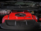 aFe Momentum GT Intake system installed in a Dodge RAM 1500 TRX V8-6.2L engine bay, featuring a vibrant red filter housing with a clear sight window.