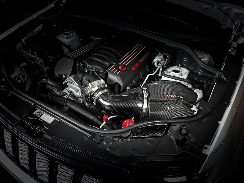Car engine with carbon fiber air intake on aFe Black Series Cold Air Intake WK2 Jeep SRT-8