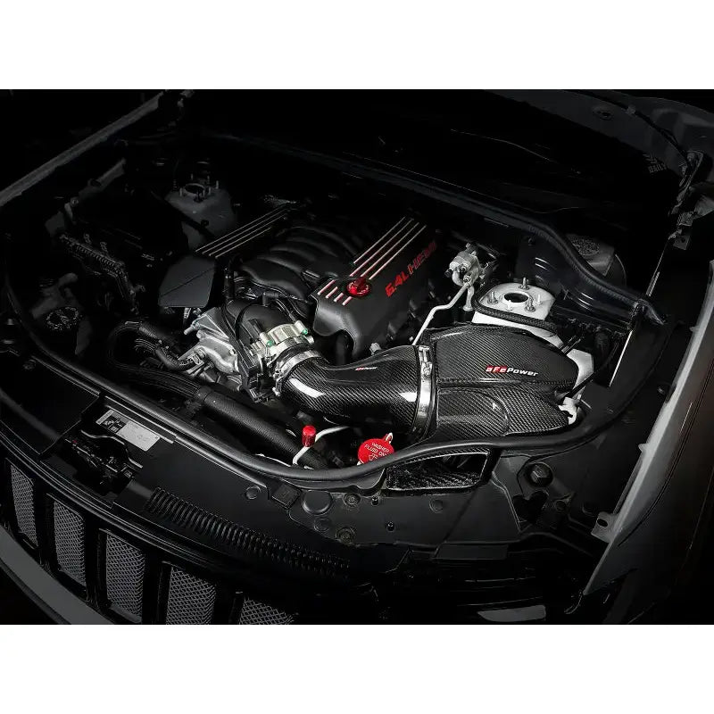 Car engine with carbon fiber air intake on aFe Black Series Cold Air Intake WK2 Jeep SRT-8