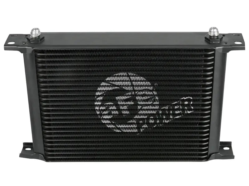 Black rectangular oil cooler from aFe Bladerunner auto transmission oil cooler kit for Silverado