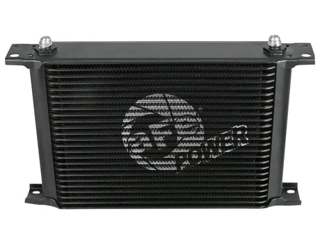 Black rectangular oil cooler from aFe Bladerunner auto transmission oil cooler kit for Silverado