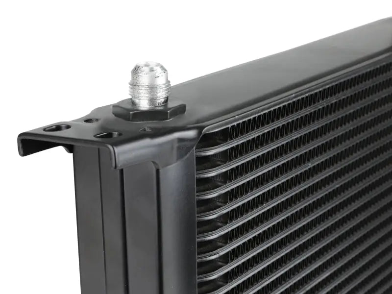 Black transmission cooler with silver fitting from aFe Bladerunner oil cooler kit for Silverado