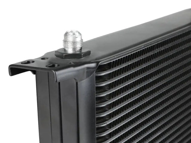 Black transmission cooler with silver fitting from aFe Bladerunner oil cooler kit for Silverado