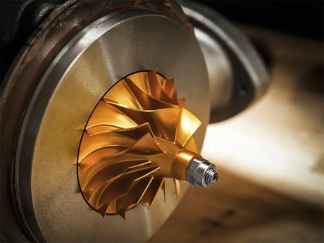 Golden turbocharger impeller from aFe BladeRunner Street Series Turbocharger for Ford Diesel Trucks