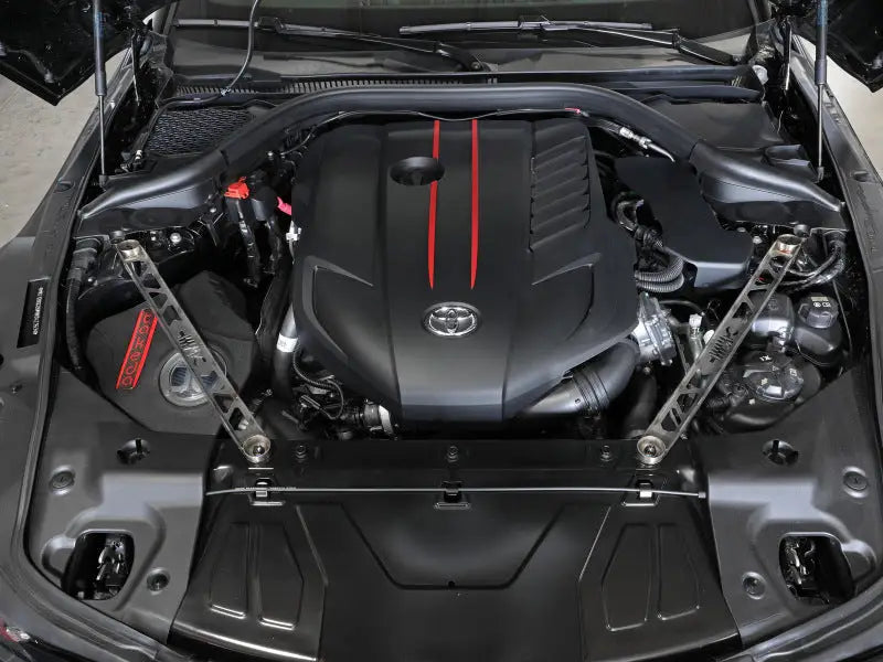 Toyota GR Supra engine with aFe Control stainless steel suspension strut brace open hood