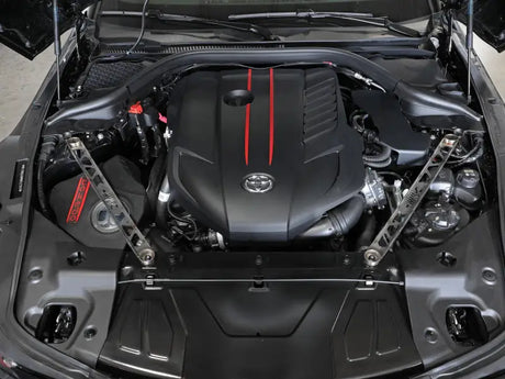Toyota GR Supra engine with aFe Control stainless steel suspension strut brace open hood