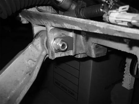 Metal automotive suspension part with bolt and nut for aFe Control PFADT camber kit