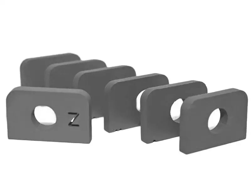 Gray rectangular shims with central holes from aFe Control PFADT Series Steel for Chevrolet Corvette