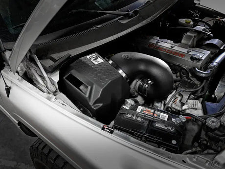 aFe Diesel Elite Intakes Stage-2 installed in Dodge Diesel Truck 94-02 L6-5.9L (td) engine bay, featuring Pro Dry S Filter for enhanced performance in RV, automotive, trucks, and off-road applications.