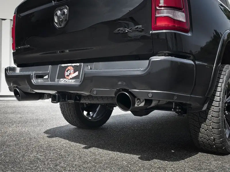 Black truck rear with dual exhaust showcasing aFe Gemini XV 3in cat-back exhaust system