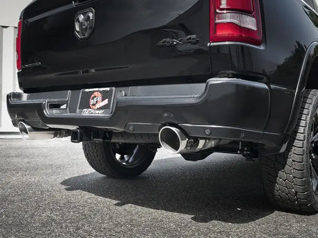Black truck rear with dual exhaust showing afe gemini xv 3in stainless steel tips